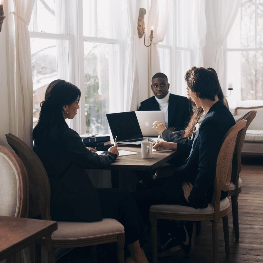 Corporate retreat participants working at a table