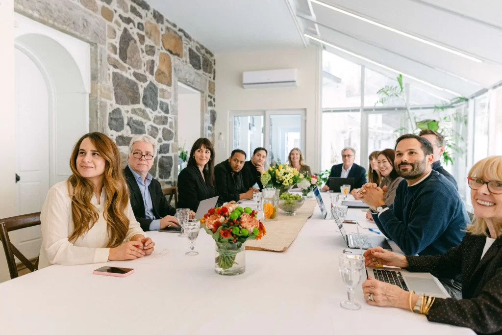 Participants at a corporate retreat at a dining table