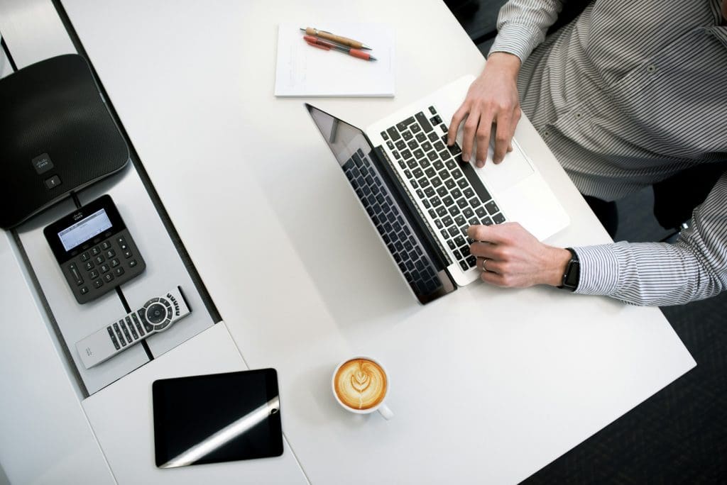 Employee working on a laptop at a corporate retreat